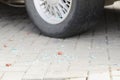 Automobile tyre and pieces of broken glass, car break in, traces of crime, car accident Royalty Free Stock Photo