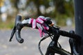 Women\'s biking gloves on the handle bar of a gravel bike Royalty Free Stock Photo