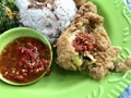 Close up of the ayam geprek with sambel on plate. Indonesian food Royalty Free Stock Photo