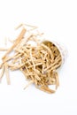 Close up of Ayurvedic herb Satavari or kurilo or Asparagus racemosus isolated on white in a glass bowl.