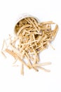 Close up of Ayurvedic herb Satavari or kurilo or Asparagus racemosus isolated on white in a glass bowl.