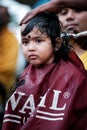 Close-up of baby boy devotee getting tonsured or head shaving ritual in Thaipusam Festival.