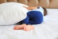 Close up of baby boy feet and toes sleeping on a bed, selective focus Royalty Free Stock Photo