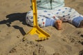 Close up baby boy playing with sand toys at the beach. Royalty Free Stock Photo