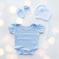 Close up of baby boys clothes for newborn on table Royalty Free Stock Photo