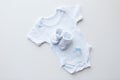 Close up of baby boys clothes for newborn on table Royalty Free Stock Photo