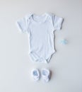 Close up of baby boys clothes for newborn on table Royalty Free Stock Photo