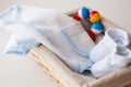 Close up of baby clothes for newborn boy in basket Royalty Free Stock Photo