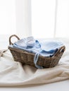 Close up of baby clothes for newborn boy in basket Royalty Free Stock Photo