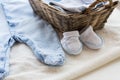 Close up of baby clothes for newborn boy in basket Royalty Free Stock Photo