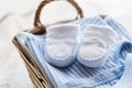 Close up of baby clothes for newborn boy in basket Royalty Free Stock Photo