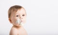 Close Up of Baby with Face Full of Cake and Frosting Royalty Free Stock Photo