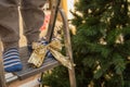 Close up baby feet on ladder near christmas tree-2