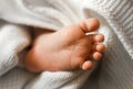 Close up Baby Foot wrapped in white blanket Royalty Free Stock Photo