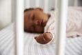 Close Up Of Baby Girl Sleeping In Nursery Cot Royalty Free Stock Photo