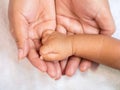 Close up baby hand on mother`s hands. Love and family concept. Royalty Free Stock Photo