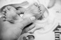 Close up baby infant feet new born black and white