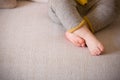 Close up baby legs. Baby feet on the sofa. Barefoot Royalty Free Stock Photo