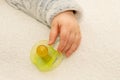 Close up of baby little hand with a pacifier dummy Royalty Free Stock Photo