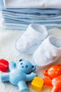 Close up of baby rattle and bootees for newborn Royalty Free Stock Photo