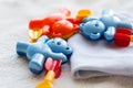 Close up of baby rattle and clothes for newborn Royalty Free Stock Photo