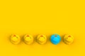 Close up of baby rubber ducks isolated. Bath toys on a yellow background. Top view with copy space. Summer wallpaper. Royalty Free Stock Photo
