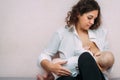 Close-up of a baby sucking on his mother`s breast. Breast-feeding Royalty Free Stock Photo