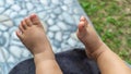 Close up of baby tini feet. baby foot on stroller. Infant boy tiny feet Royalty Free Stock Photo