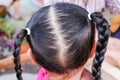 Close up back of asian child head with braided hair