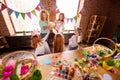 Close up back behind rear photo three small girls children day take hands arms two mom bring gift boxes glad interested Royalty Free Stock Photo