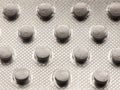 Close up of back of foil tablet packet white pills Royalty Free Stock Photo