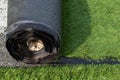 Close-up of the back of a roll of artificial turf