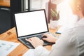 Close-up back view of a business woman working in the office typing. Royalty Free Stock Photo