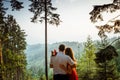 Close-up back view of the pretty hugging couple enjoying the sunset in the mountains. No face. Romantic portrait. Royalty Free Stock Photo