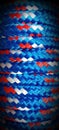 Close-up background of blue and red diamond braided rope with space for copy