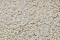 Raw long grain rice macro view. Royalty Free Stock Photo