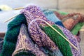 Close-up background image of a variegated knitted blanket with a colorful graphic design