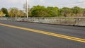 Close-up background of a new asphalt road surface with yellow stripes Royalty Free Stock Photo