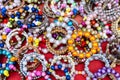 A close-up background of numerous bracelets made of colorful beads Royalty Free Stock Photo