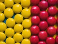 Top view of yellow and red chocolate candies. Colorful background