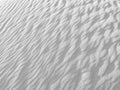 Close up of background texture of desert sand dunes. Beautiful structures of sandy dunes on sunny summer day. Annual growth of are