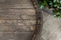 Close-up background of top of old retro vintage weathered wooden cask barrel. Wineyard, distillery, pub or bar table Royalty Free Stock Photo