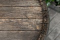 Close-up background of top of old retro vintage weathered wooden cask barrel. Wineyard, distillery, pub or bar table Royalty Free Stock Photo