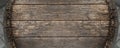 Close-up background of top of old retro vintage weathered wooden cask barrel. Wineyard, distillery, pub or bar table Royalty Free Stock Photo