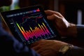 Close up of backlit hand at desk using tablet with abstract glowing money mesh on blurry background. Cryptocurrency and