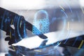 Close up of backlit woman hand pointing at pad at desktop with glowing security padlock on background. Secure, safety and digital