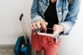 Close up of backpacker caucasian woman at train station using smart phone app while waiting. Travel concept Royalty Free Stock Photo