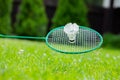 Close up Badminton racket and shuttle on green grass backgroung, copy space Royalty Free Stock Photo