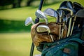 Close Up of a Bag of Golf Clubs, A golf club bag filled with various clubs on a golf cart, AI Generated Royalty Free Stock Photo