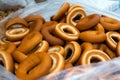 Close up of bagel buns at holiday fair. Bunch of sweet ring bun pastry for sale